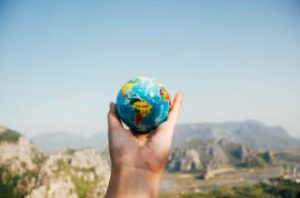 hand holding a globe